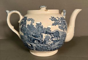 A large blue and white ceramic tea pot decorated in a pastoral farm yard scene by Adams