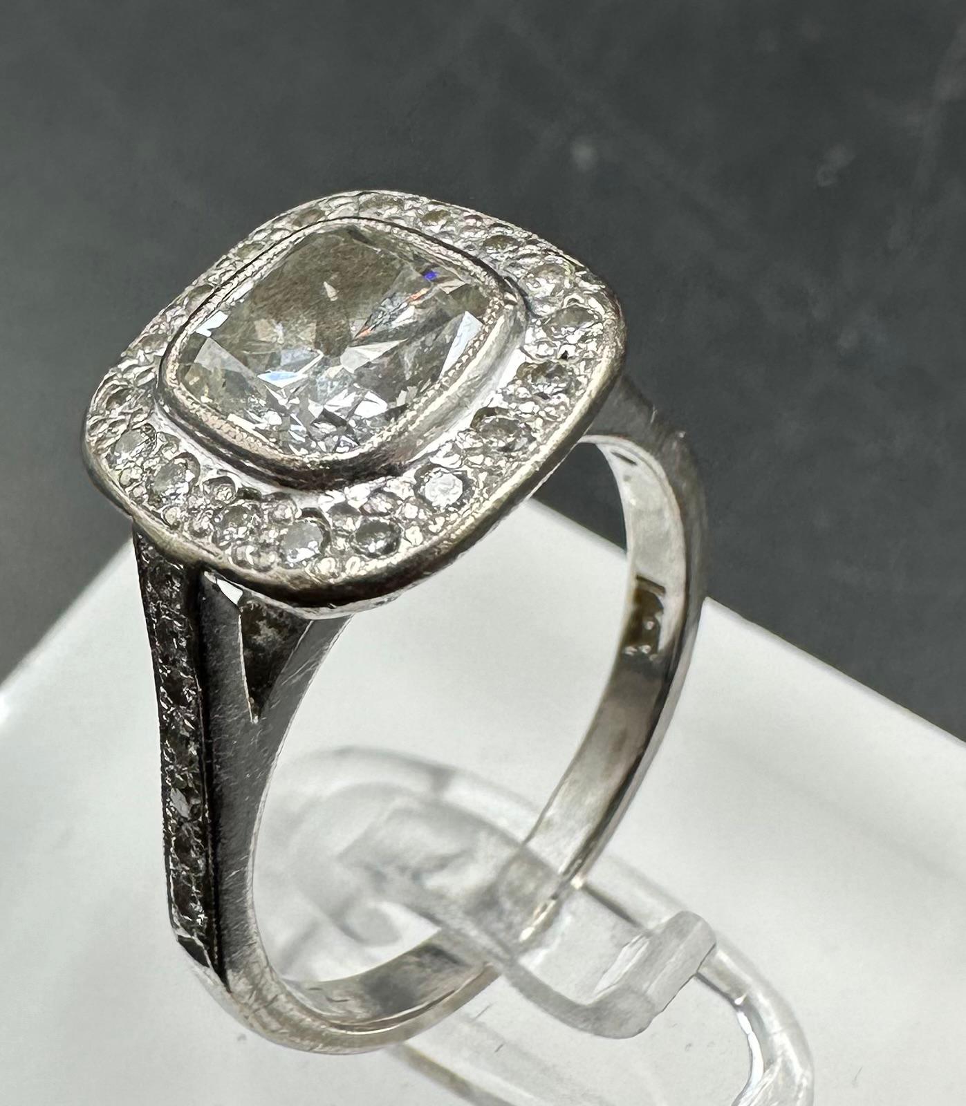 An 18ct white gold diamond ring with central stone of approximately 1.2ct and approximately 0.3ct