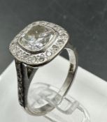 An 18ct white gold diamond ring with central stone of approximately 1.2ct and approximately 0.3ct