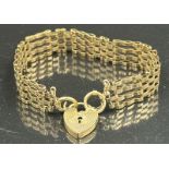 A 9ct yellow gold gate bracelet with heart shaped fastner, approximate total weight 16.3g