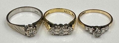 A selection of three 18ct gold rings, various styles and settings, approximate combined total weight
