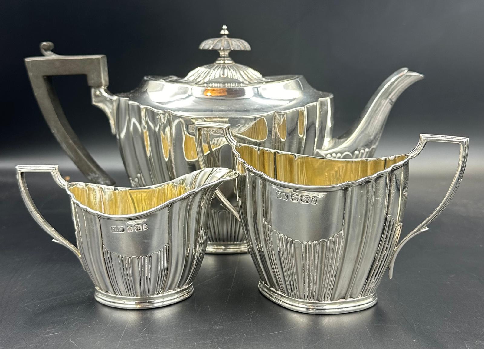 A three piece silver tea service by Lee & Wigfull with a semi fluted design hallmarked for Sheffield - Image 3 of 3