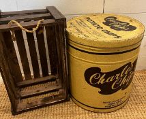 A large tin adverting Potato Chips and a wooden crate