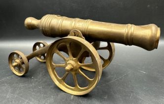 A vintage brass desk cannon