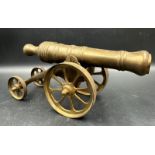 A vintage brass desk cannon