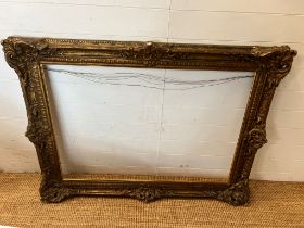 A gilt carved frame (rebate 75cm x 107cm)
