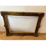 A gilt carved frame (rebate 75cm x 107cm)