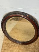 A oval mahogany wall mirror 62cm)