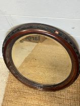 A oval mahogany wall mirror 62cm)
