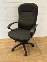 A black adjustable office chair on castors