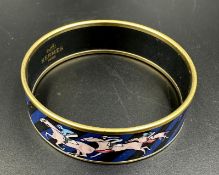 A horse racing themed bangle by Hermes, made in Austria