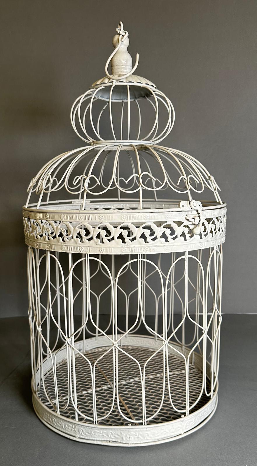 A white painted metal bird cage