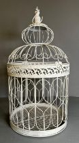 A white painted metal bird cage