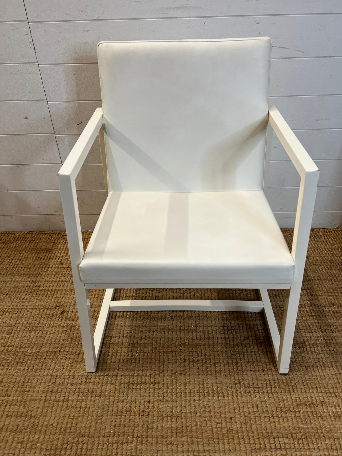 A white open armchair by Casabella