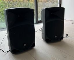 A pair of Thump 15 powered loud speakers