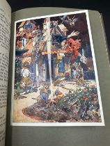 A hardback copy of Alice in Wonderland published by Thomas Nelson and Sons with colour tipped in