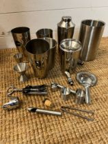 A collection of cocktail making equipment to include ice buckets, shakers etc