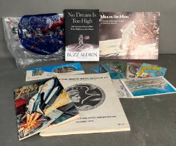A selection of Nasa memorabilia to include postcards and a ticket from the Kennedy Space centre