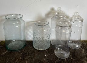 Three plastic sweet shop style jars and two glass vases