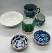 A collection of Studio Pottery Condition Report small bowls have chips