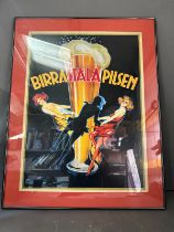 A framed Birra Itala poster