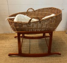A wicker mosses basket on stand (H73cm W87cm)