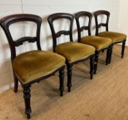A set of four mahogany Victorian dining chairs upholstered in green