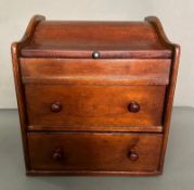 A vintage mahogany two drawer desk tidy in the form of a bureau (H31cm W28 D24cm)