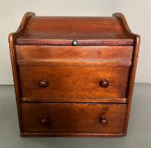 A vintage mahogany two drawer desk tidy in the form of a bureau (H31cm W28 D24cm)