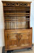A vintage pine Welsh dresser, three shelf plate rack and two cupboard under