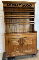 A vintage pine Welsh dresser, three shelf plate rack and two cupboard under