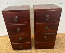 A pair of four drawer Indonesian hardwood bedside tables (H62cm W30cm D30cm)