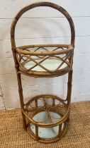 A vintage bamboo bottle holder with shelf over (H80cm)