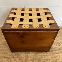 A pine storage box or stool with webbed hessian seat and brass drop handles to side (H37cm W46cm