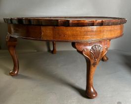 A circular coffee table with pie crust rim on carved cabriole legs (H37cm Dia78cm)