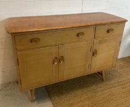 An Ercol sideboard model 351 on short splayed legs (H82cm W123cm D46cm)