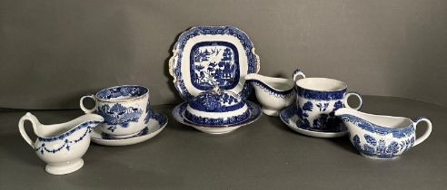 A selection of blue and white china to include large cups and saucers, sauce boats and a plate,