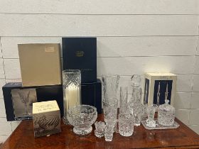A selection of cut glass crystal including vases, candlesticks etc