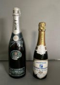 A bottle of Moet and Chandon 1977 silver jubilee champagne and a half bottle of chateau Delqueau