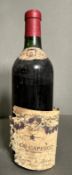 A bottle of 1959 Caperot St Emilion with indistinct lable.