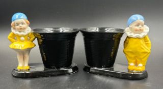 A pair of china Pierrot style figured vases