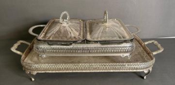 White metal serving dishes along with a matching tray