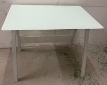 A contemporary metal frame, glass topped desk (H76cm D70cm W100cm)