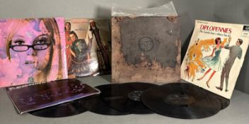 A selection of vinyl lps in a vintage Columbia records case