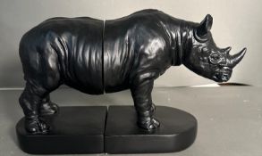 A pair of bookends in the form of rhinoceros.