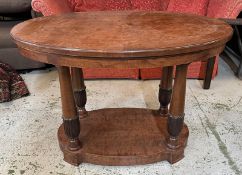 An Empire style centre table on four fluted columns (H77cm W110cm D76cm)