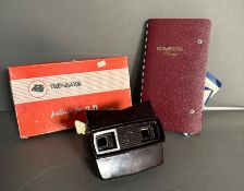 A View Master, Bakelite, with an album of various viewing cards to include Paris, Highland scenes,