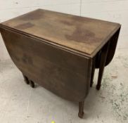 A mahogany dropped leaf dining table on square tapering legs (H74cm W90cm D50Ccm folded)