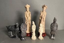A selection of seven Chinese figures in resin and porcelain