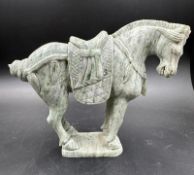 A Chinese hard stone carved and polished figure of a horse